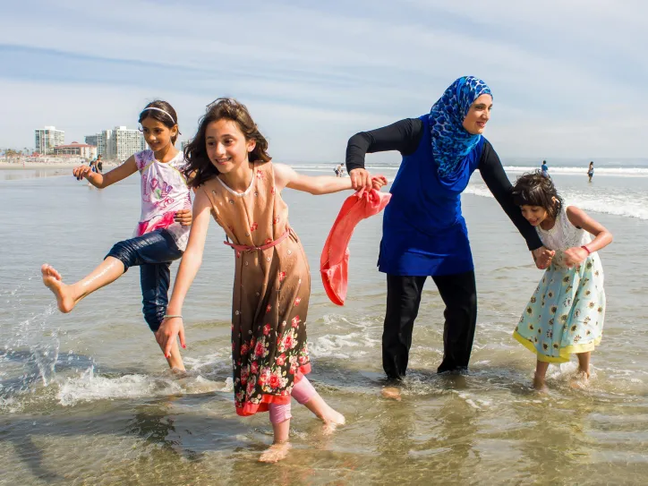 women running with children 