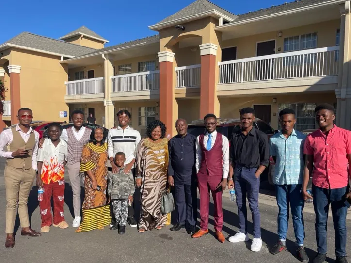 The Moboka family stand outside of their new home in Denver