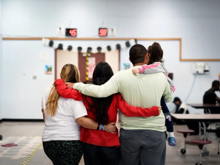 Family embracing at Phoenix Welcome Center 