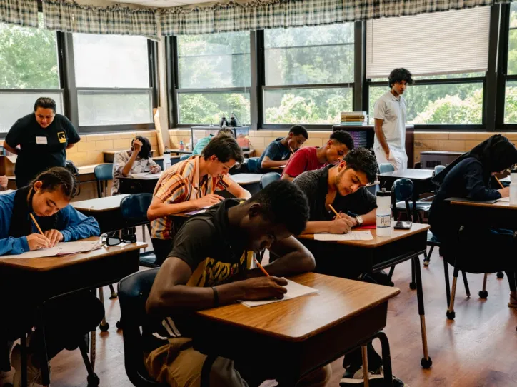 Youth sitting at their desks and learning