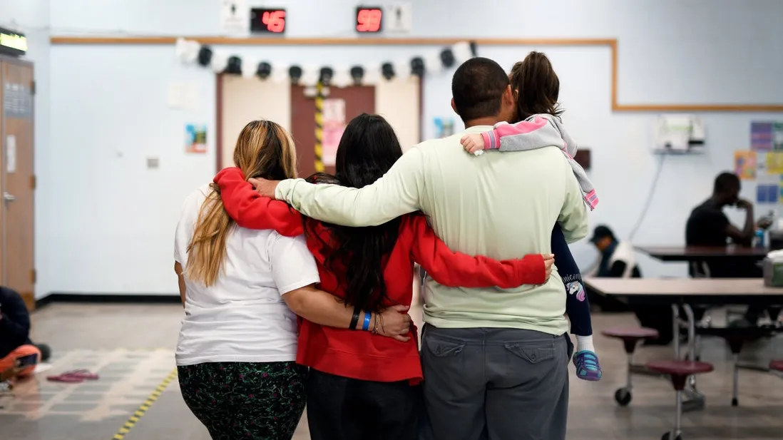 Family embracing at Phoenix Welcome Center 