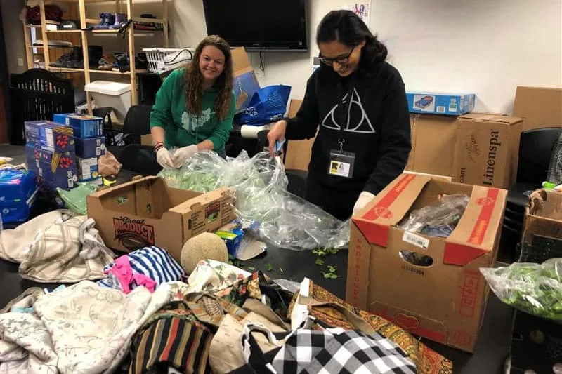 IRC staff organizing donated clothing