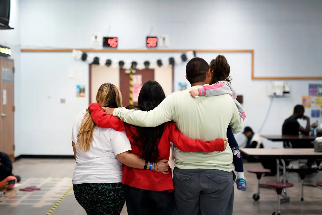 Family embracing at Phoenix Welcome Center 