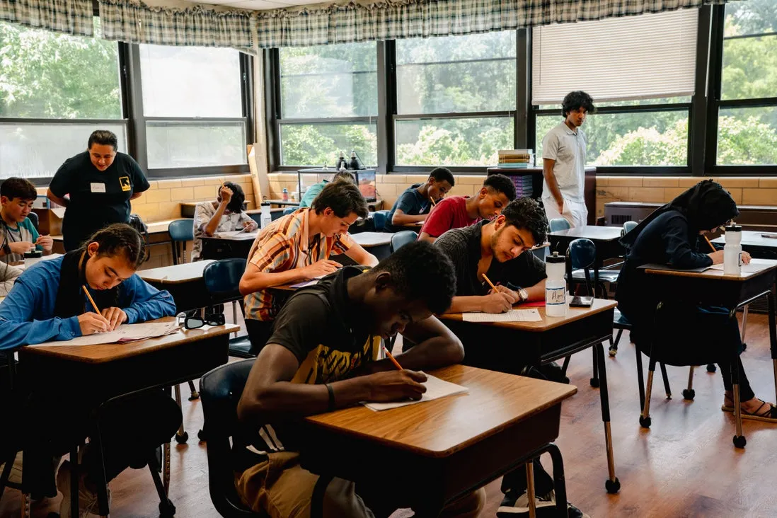Youth sitting at their desks and learning